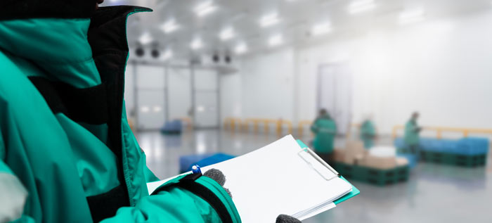A person inspecting a cold room