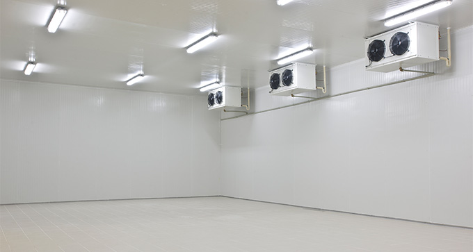 empty industrial space with white walls three cooling units installed on the ceiling